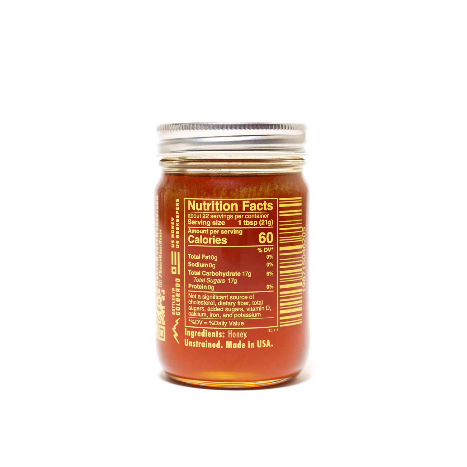A clear glass jar of Honey House Honey Alfalfa Honey from Colorado, sealed with a metal lid. The label features nutrition facts, an ingredients list, states its made in the USA, and highlights only pure honey rich in antioxidants.