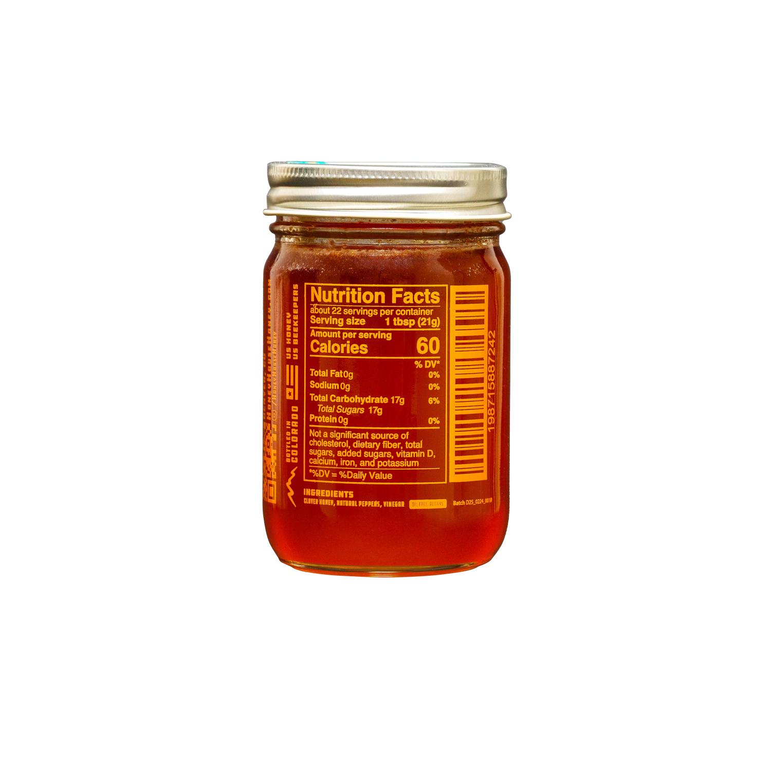 A glass jar of Honey House Honeys Hot Honey with a metal lid and side nutrition label, filled with golden-brown honey, set against a solid black background.